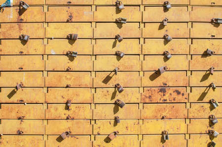 Panel of metal intage grunge locked with padlocks post boxes closeup