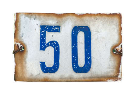 Weathered grunge square metal enameled plate of number of street address with number 50 closeup isolated on white backgroundの写真素材