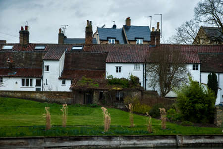 View of countryside town with traditional British houses by the river