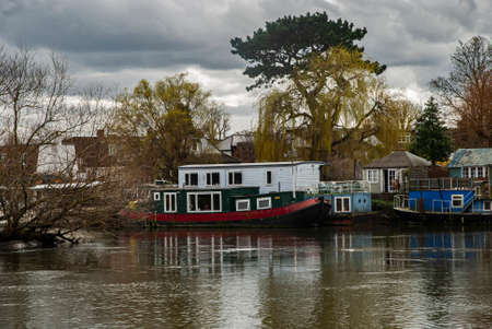 Canal narrow houseboats on English canal riverの写真素材