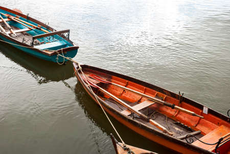 Punt flat bottom river wooden boats on river Thames waters in Richmond, Londonの写真素材
