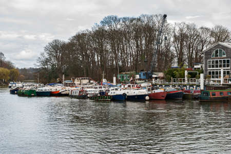 Canal narrow houseboats on English canal river