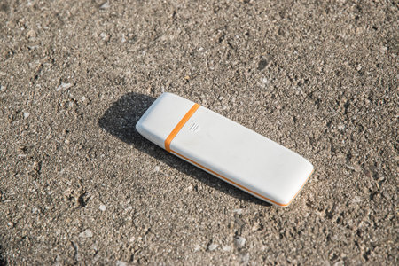 USB flash memory drive closeup on cement surface