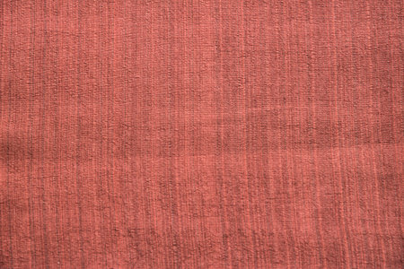 Brick red linen fabric texture closeup as textile backgroundの写真素材