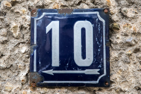 Weathered grunge square metal enameled plate of number of street address with number 10の写真素材
