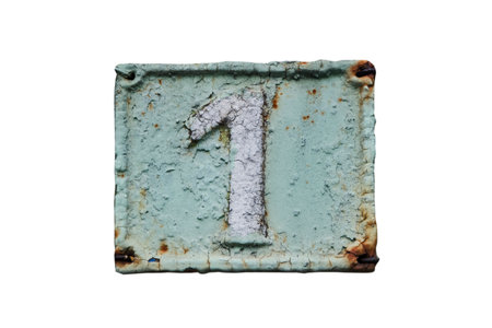 Old retro weathered cast iron plate with number 1 closeup isolated on white backgroundの写真素材