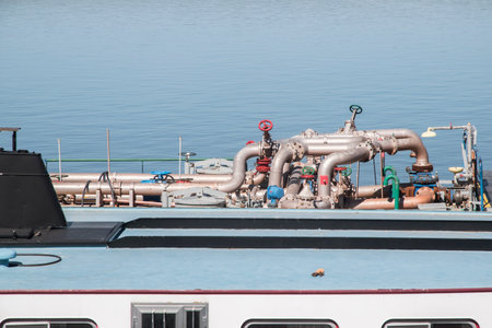 Pipes, valves and other equipment on the deck of a ferryの写真素材