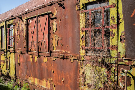 Rusty old train wagon in an abandoned railway station in the countryside