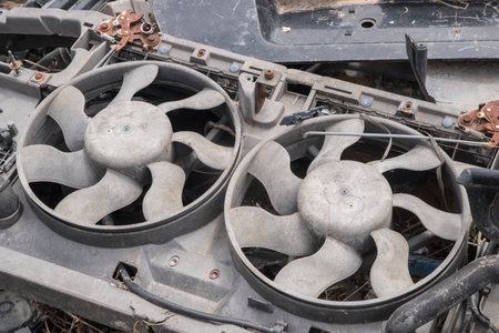 Close-up of the cooling fan of crashed car in scrap yardの写真素材