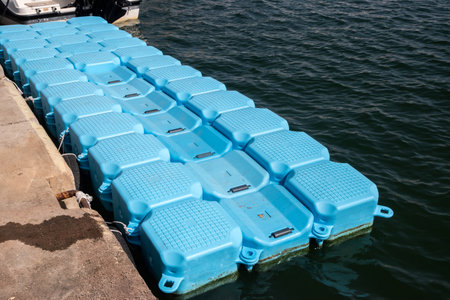 Plastic Modular Floating Dry Dock for Boats closeup on sunny dayの写真素材