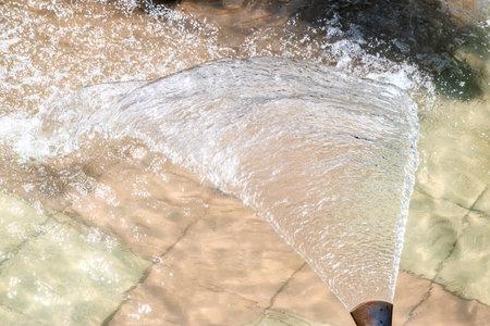 Water fountain in the park, close-up of water splashingの写真素材