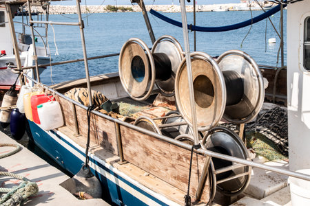 Fishing boat net drum winch closeup on sunny summer day