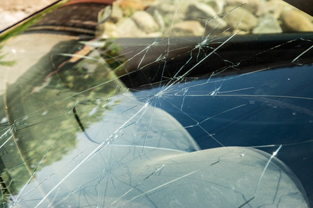 Broken windshield glass of car after accident closeupの写真素材