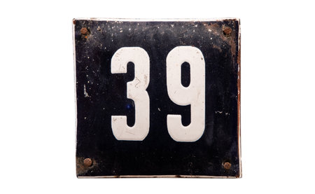 Weathered grunge square metal enameled plate of number of street address with number 39 isolated on...