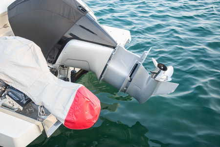 Close-up of a motor boat engine on the sea background.の写真素材