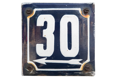 Weathered grunge square metal enameled plate of number of street address with number 30 isolated on...