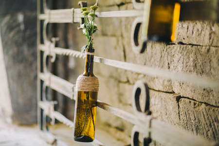 Glass decoration, flowers in glass bottle.Outdoor decoration elementの写真素材