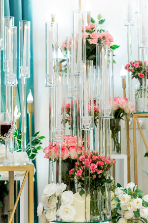 Luxurious wedding decoration with glasses and artificial rosesの写真素材