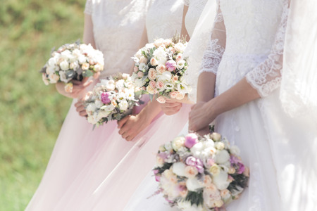 Witnesses at the wedding with beautiful bouquets in gentle tonesの写真素材
