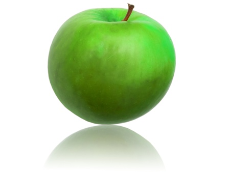 Green apple mirrored on white backgroundの写真素材