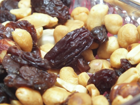 background of mixture of nuts and raisins, closeupの写真素材