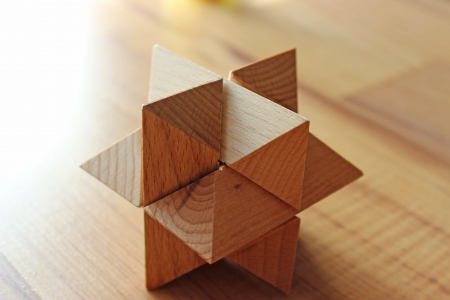 Wooden 3D puzzle on the floorの写真素材