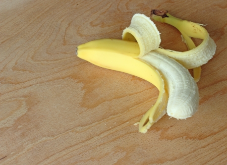 Fresh banana on wooden background の写真素材