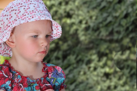 cute toddler girl in the gardenの写真素材