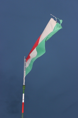 Waving Hungarian Flag Against Blue Sky の写真素材
