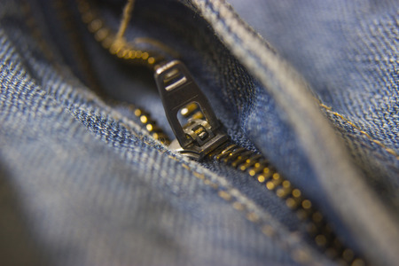 jeans zipper closeup with shallow depth of fieldの写真素材