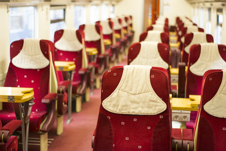 Rows of red seats in modern train