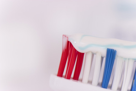 Blue toothbrush with toothpasteの写真素材