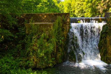 Artificial waterfall at a Hungarian tarn in the summer, Josvafoの写真素材