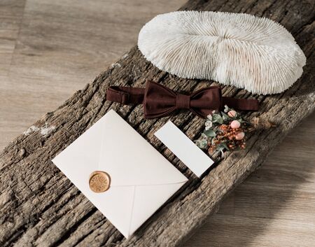 wedding invitation card, wax seal, vase, sea stone, flowers. Wedding calligraphy vintage top view. Bridal morning details.の写真素材