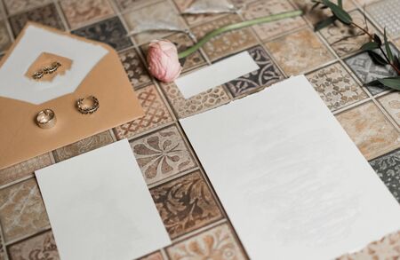 Rustic Wedding invitation card, wax seal, vase, sea stone, flowers. Wedding calligraphy vintage top viewの写真素材