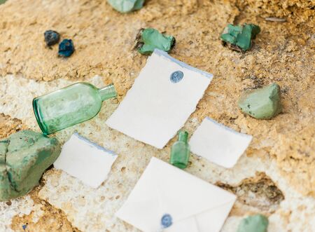Luxury decorated table and wedding cake for a romantic date. Wedding details: candles, letter, cake on a mountain on backgroundの写真素材