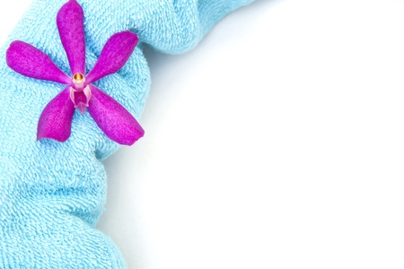 Fresh bath towels with a orchid flowerの写真素材