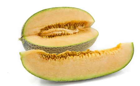 cantaloupe melon with a slice isolated on white backgroundの写真素材