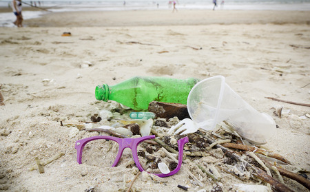 garbages, plastic, and wastes on the beach after winter storms