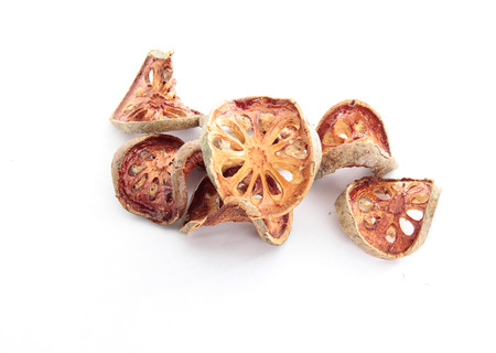 Bael fruit dried isolated on white backgroundの写真素材