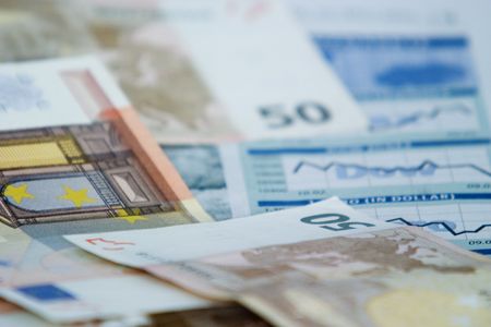 European bank notes on the financial news of a newspaper