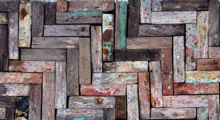 Rustic wooden mosaic texture. Creative wood background. Patterned and textured grunge wall. Natural interior design.の写真素材