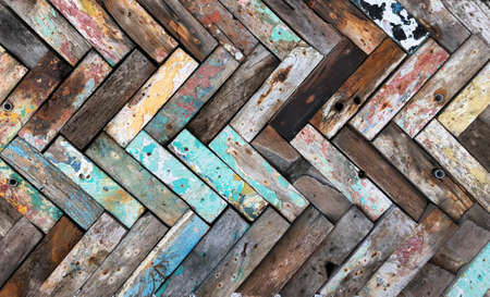 Rustic wooden mosaic texture. Creative wood background. Patterned and textured grunge wall. Natural interior design.の写真素材
