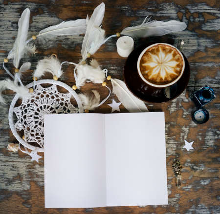 Boho cracky background for mockup with cup of cappuccino. Desk for artist, painter. Copy space for text. Natural, rustic, ethnic or hipster vintage mock up. Top view. Shabby chic style workplaceの写真素材
