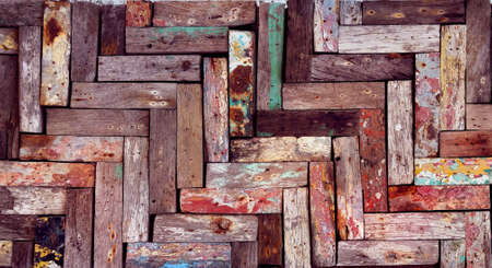 Rustic wooden mosaic texture. Creative wood background. Patterned and textured grunge wall. Natural interior design.の写真素材