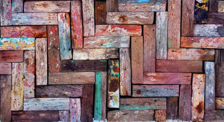 Rustic wooden mosaic texture. Creative wood background. Patterned and textured grunge wall. Natural interior design.の写真素材