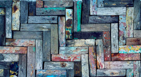 Rustic wooden mosaic texture. Creative wood background. Patterned and textured grunge wall. Natural interior design.の写真素材