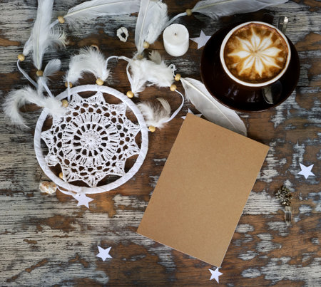 Boho cracky background for mockup with cup of cappuccino. Desk for artist, painter. Copy space for text. Natural, rustic, ethnic or hipster vintage mock up. Top view. Shabby chic style workplaceの写真素材