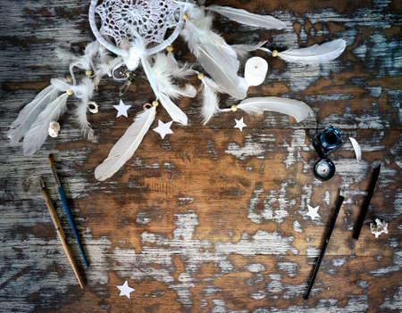 Boho cracky background for mockup with cup of cappuccino. Desk for artist, painter. Copy space for text. Natural, rustic, ethnic or hipster vintage mock up. Top view. Shabby chic style workplaceの写真素材