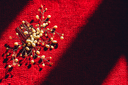 beautiful handmade hair decoration on red backgroundの写真素材